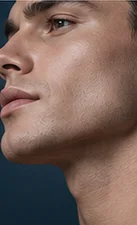 Profile of a man against a deep navy background