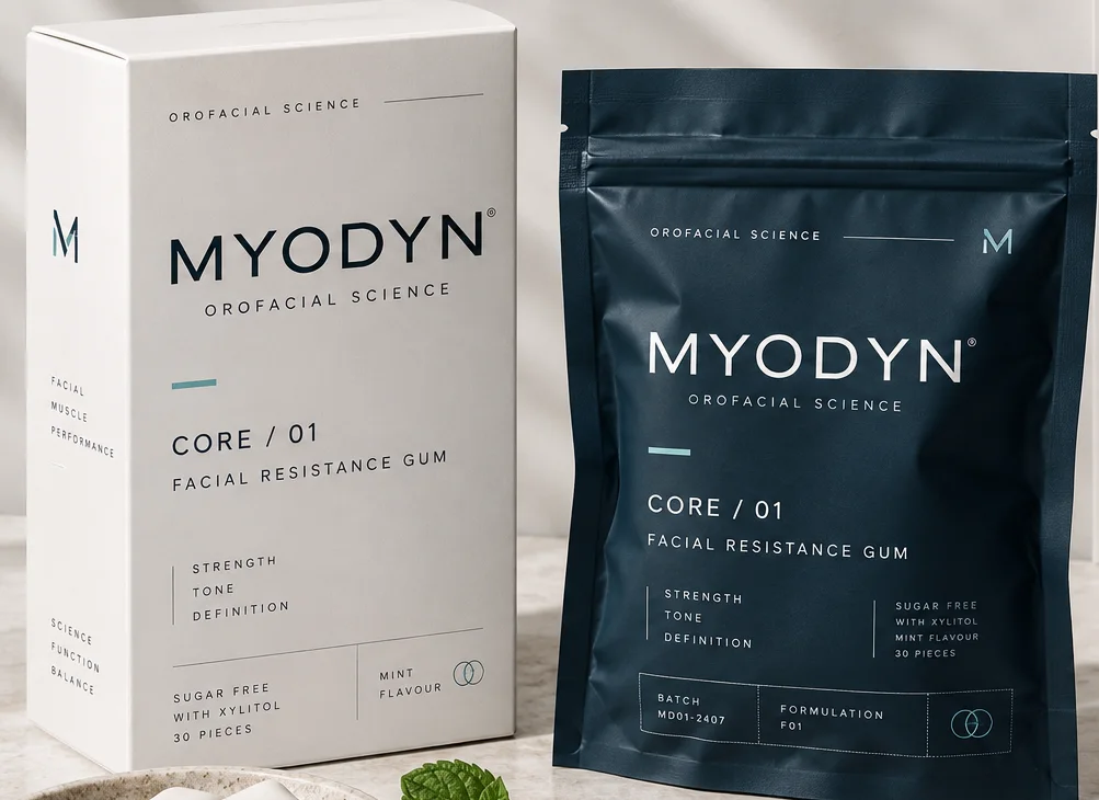 MYODYN CORE / 01 packaging concept: a white carton and a navy zip pouch on a stone surface